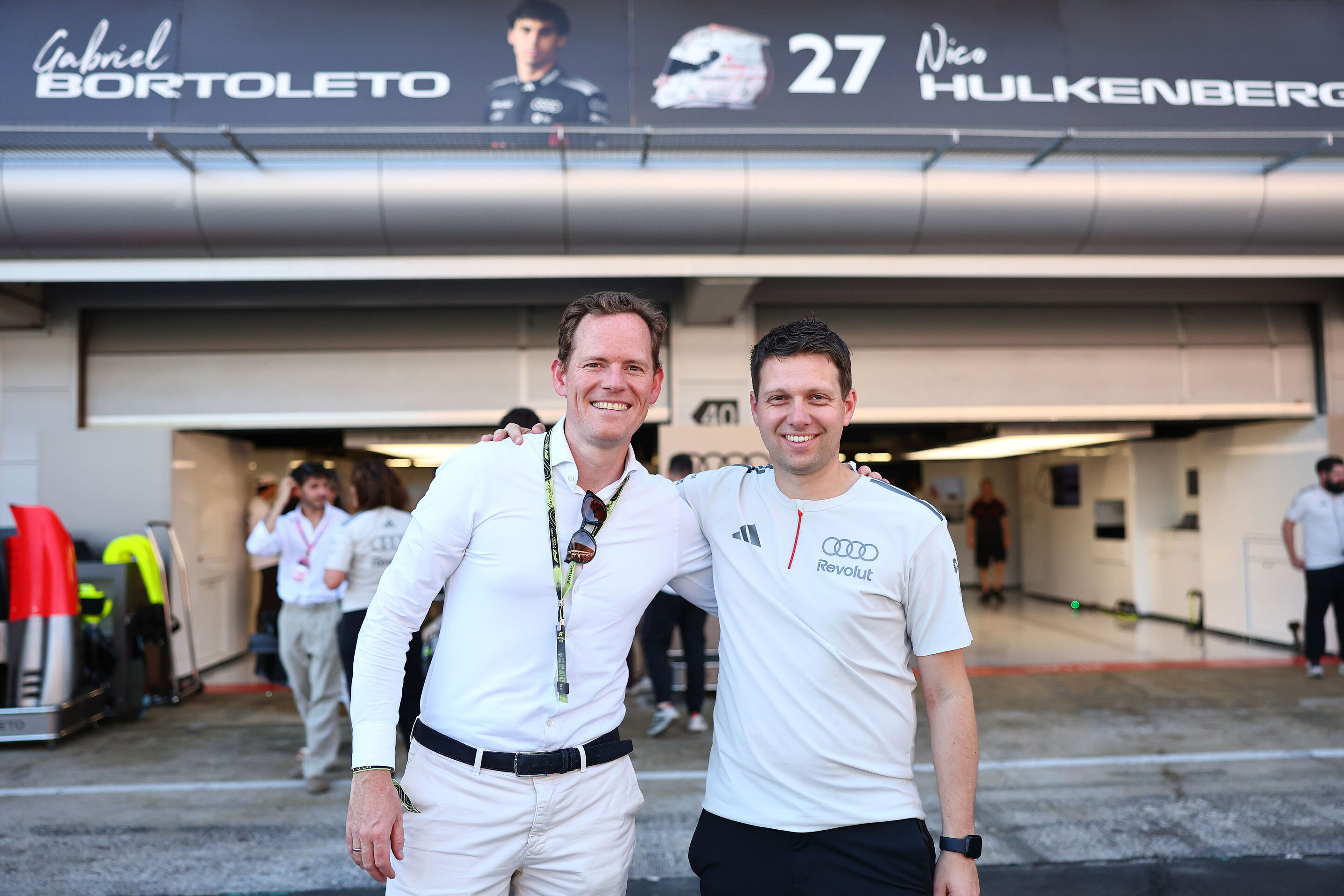 2026 Grand Prix de Barcelona - Guests - BARCELONA, SPAIN - JUNE 13: A team member of Audi F1 Team poses for a photo with a guest during qualifying ahead of the F1 Grand Prix of Barcelona-Catalunya at Circuit de Barcelona-Catalunya on June 13, 2026 in...