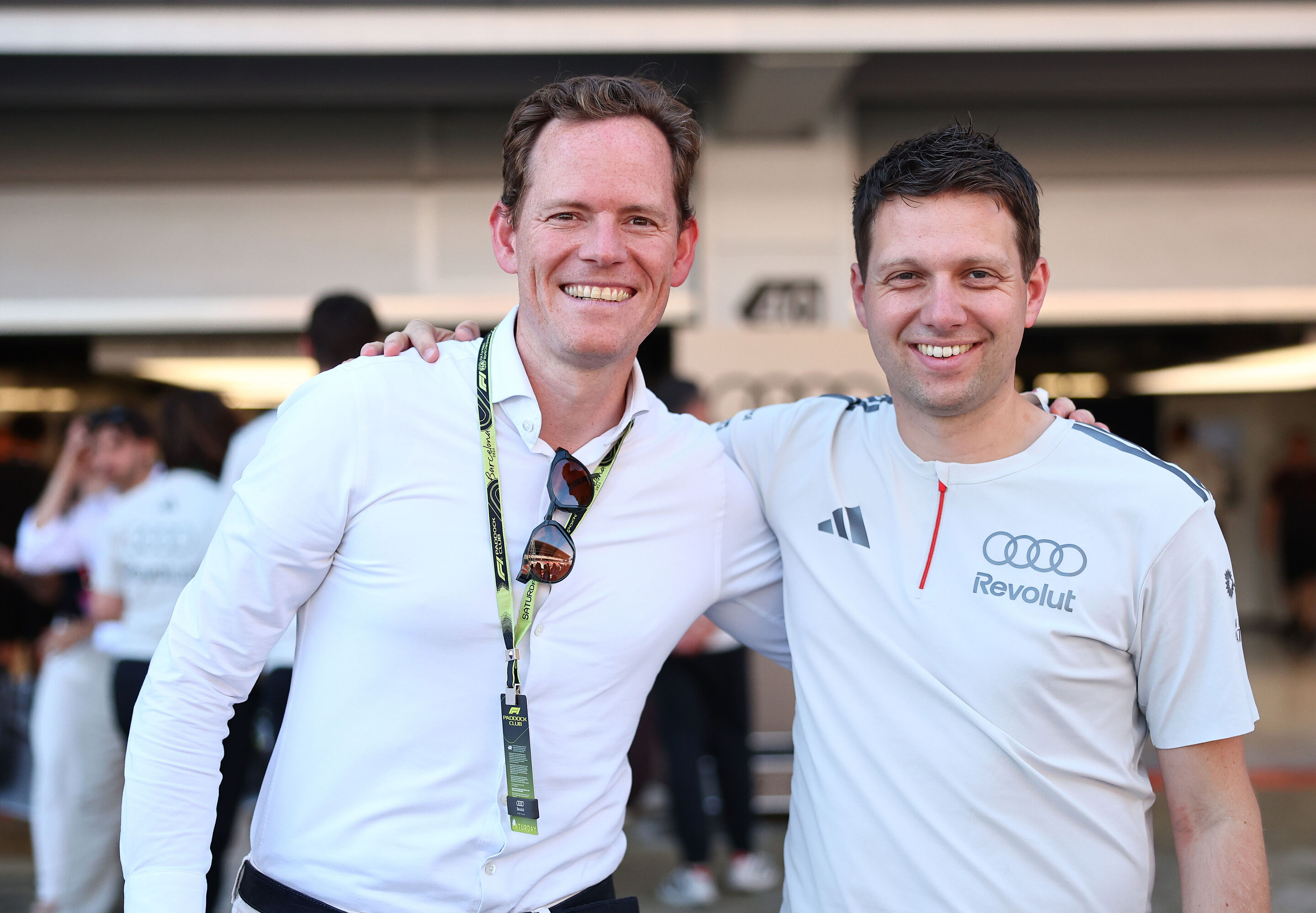 2026 Grand Prix de Barcelona - Guests - BARCELONA, SPAIN - JUNE 13: A team member of Audi F1 Team poses for a photo with a guest during qualifying ahead of the F1 Grand Prix of Barcelona-Catalunya at Circuit de Barcelona-Catalunya on June 13, 2026 in...