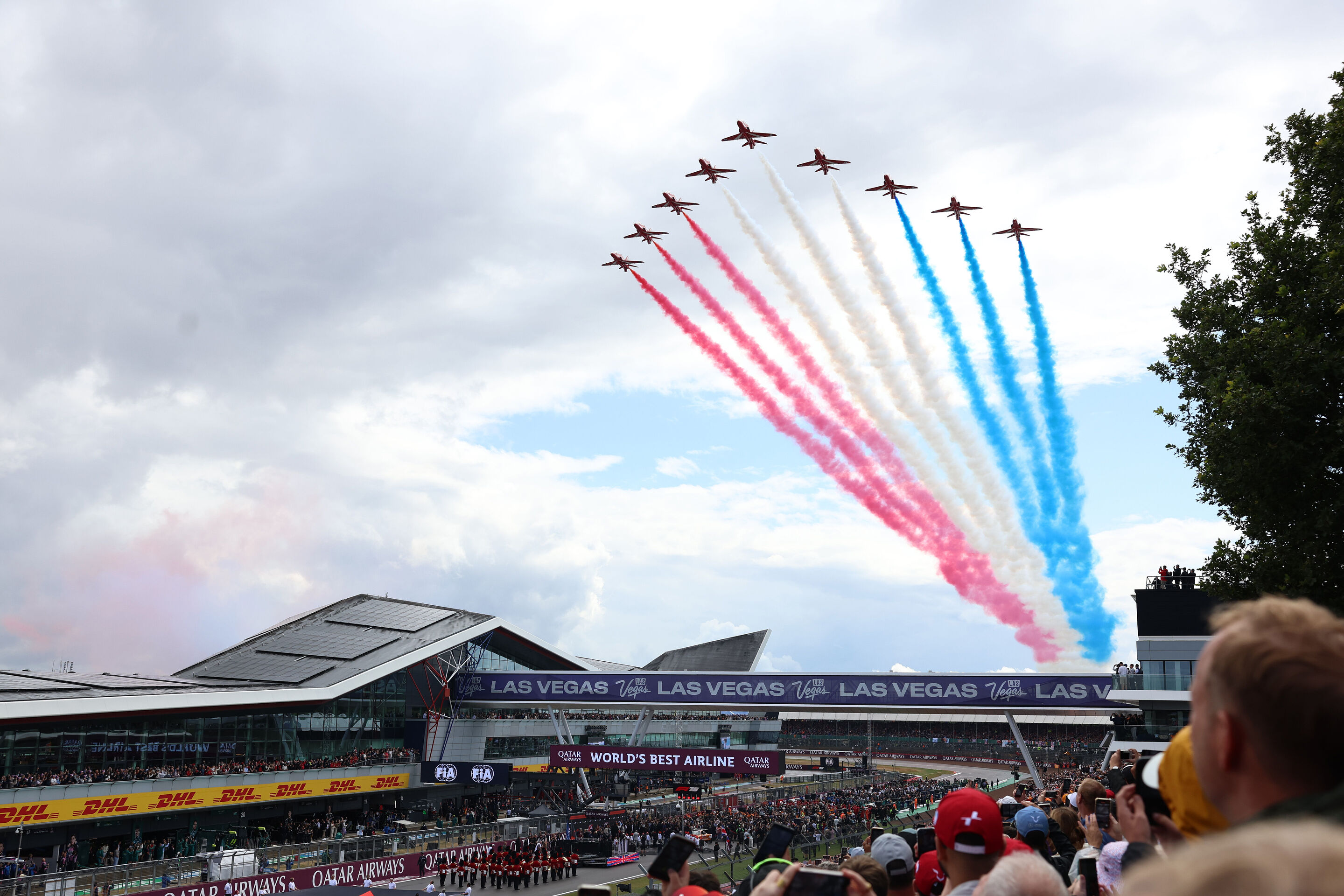 2223806149 - NORTHAMPTON, ENGLAND - JULY 06: The Red Arrows fly over the grid during the F1 Grand Prix of Great Britain at Silverstone Circuit on July 06, 2025 in Northampton, England. (Photo by Alastair Staley/LAT Images)