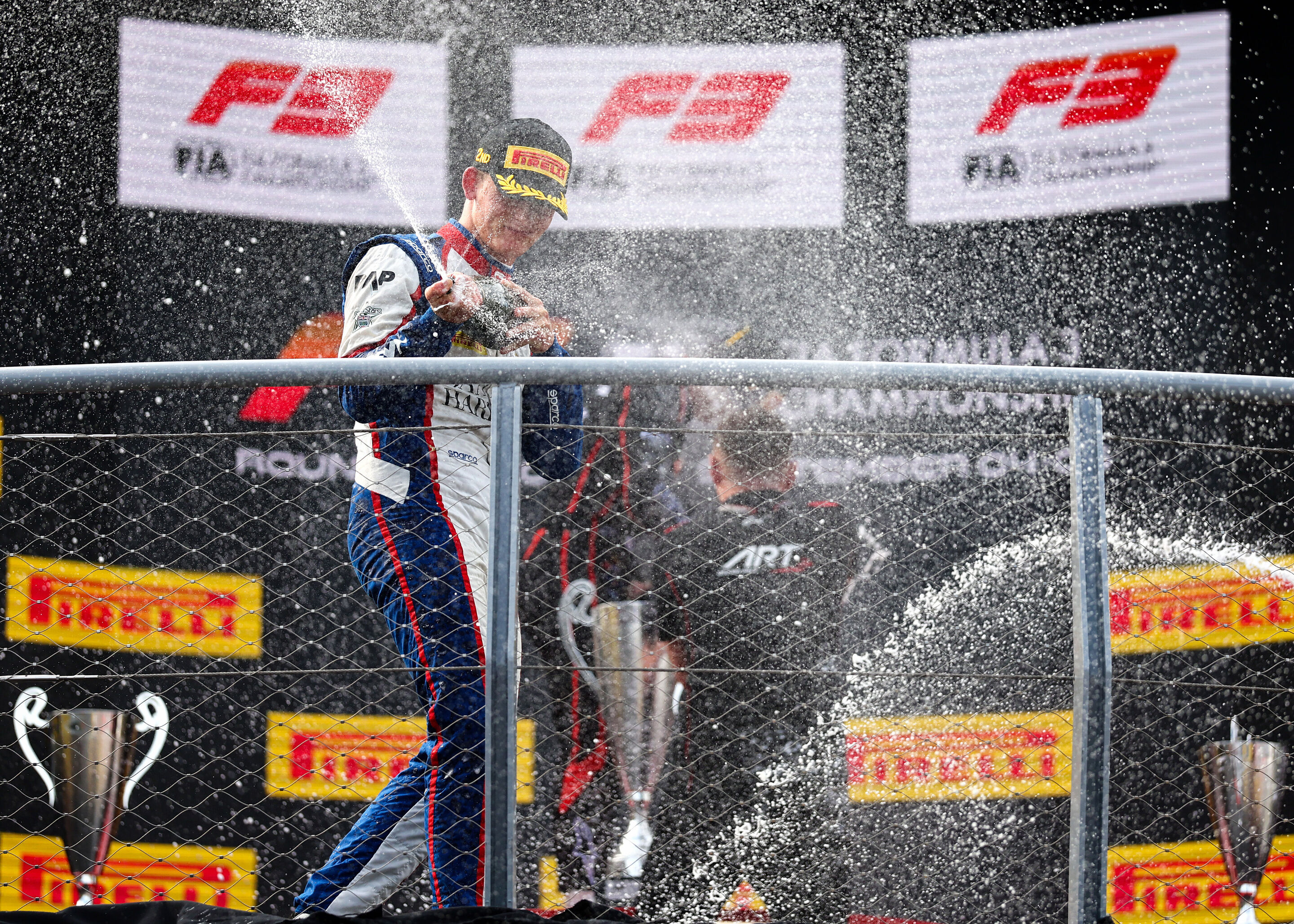 2026 Italian Grand Prix - F3 - MONZA, ITALY - SEPTEMBER 05: Second placed Freddie Slater of Great Britain and TRIDENT (5) and Audi F1 Team celebrates with Champagne on the podium during the Round 8 Monza Sprint race of the Formula 3 Championship at Autodromo...