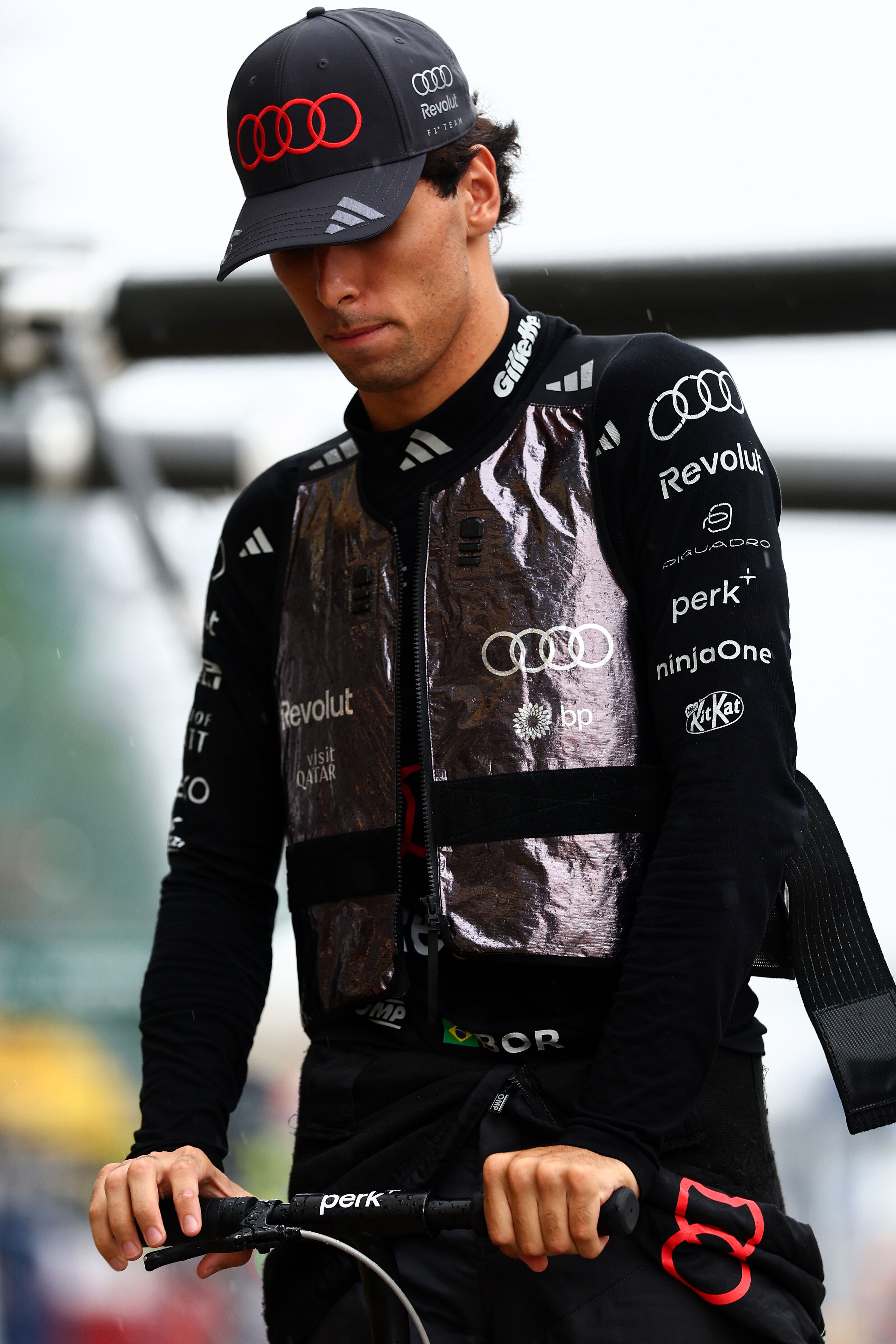 F1 Grand Prix of Bahrain in Malaysia - KUALA LUMPUR, MALAYSIA - OCTOBER 04: Gabriel Bortoleto of Brazil and Audi F1 Team on a scooter in the Pitlane prior to the F1 Grand Prix of Bahrain in Malaysia at Sepang Circuit on October 04, 2026 in Kuala Lumpur,...