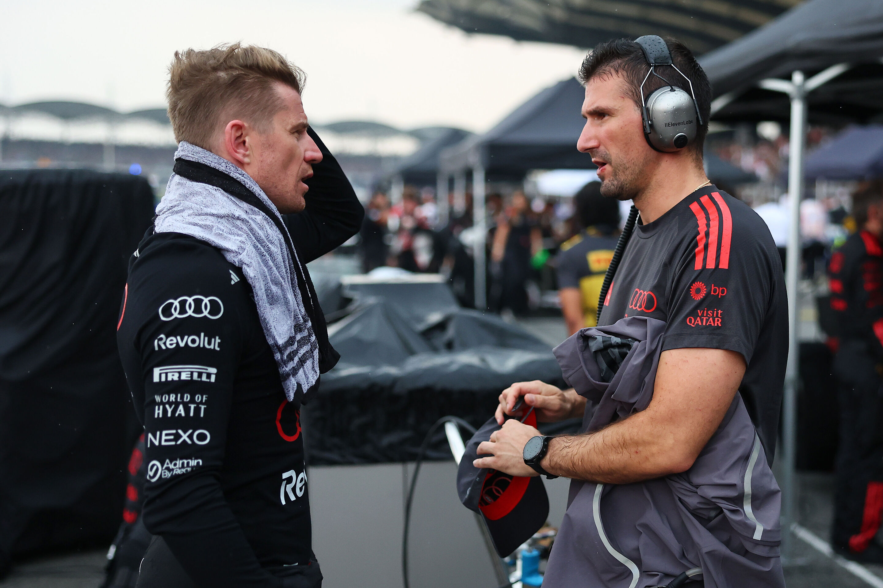 F1 Grand Prix of Bahrain in Malaysia - KUALA LUMPUR, MALAYSIA - OCTOBER 04: Nico Hulkenberg of Germany and Audi F1 Team talks on the grid prior to the F1 Grand Prix of Bahrain in Malaysia at Sepang Circuit on October 04, 2026 in Kuala Lumpur, Malaysia....