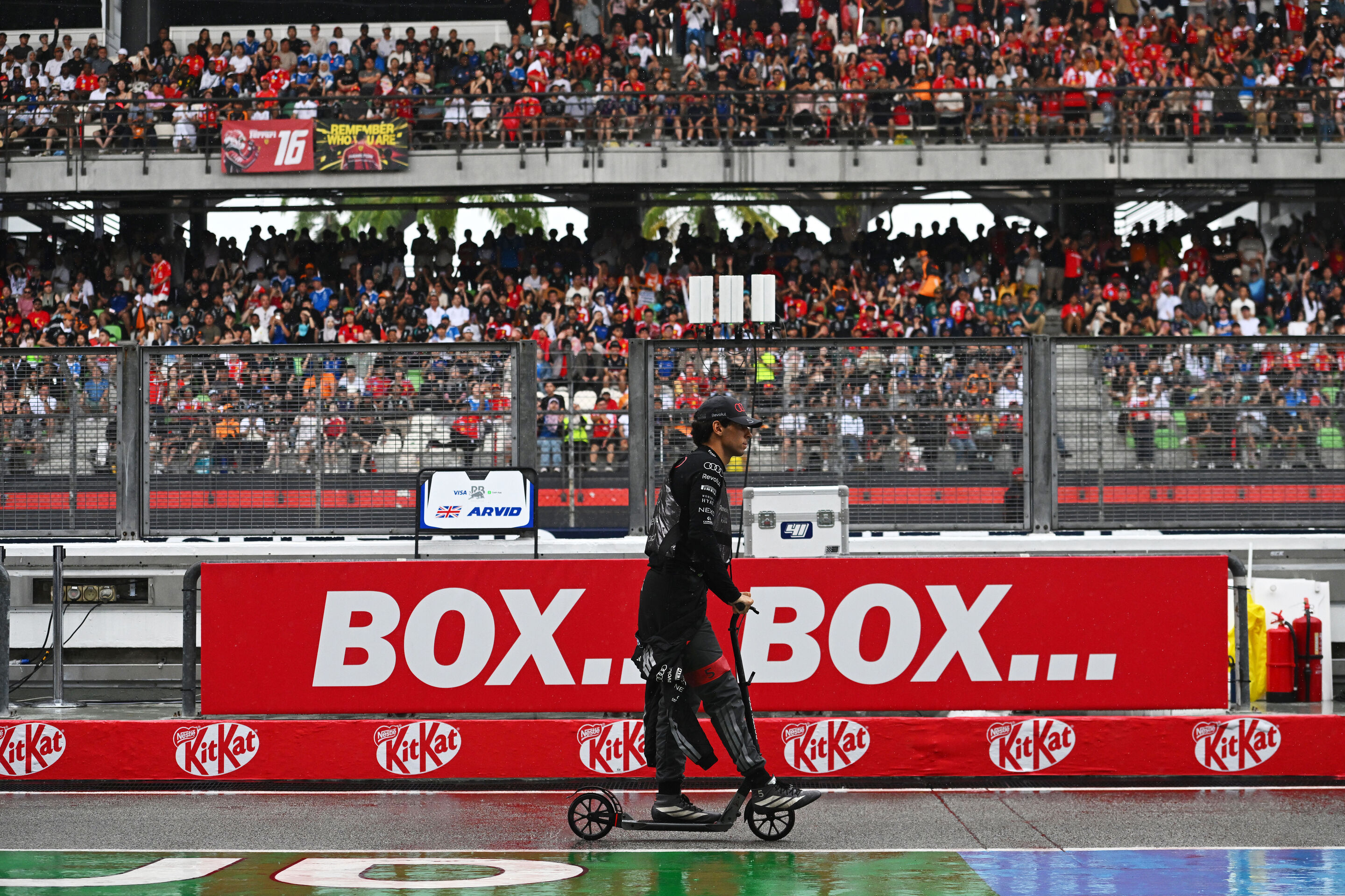 F1 Grand Prix of Bahrain in Malaysia - KUALA LUMPUR, MALAYSIA - OCTOBER 04: Gabriel Bortoleto of Brazil and Audi F1 Team rides his scooter in the Pitlane prior to the F1 Grand Prix of Bahrain in Malaysia at Sepang Circuit on October 04, 2026 in Kuala...