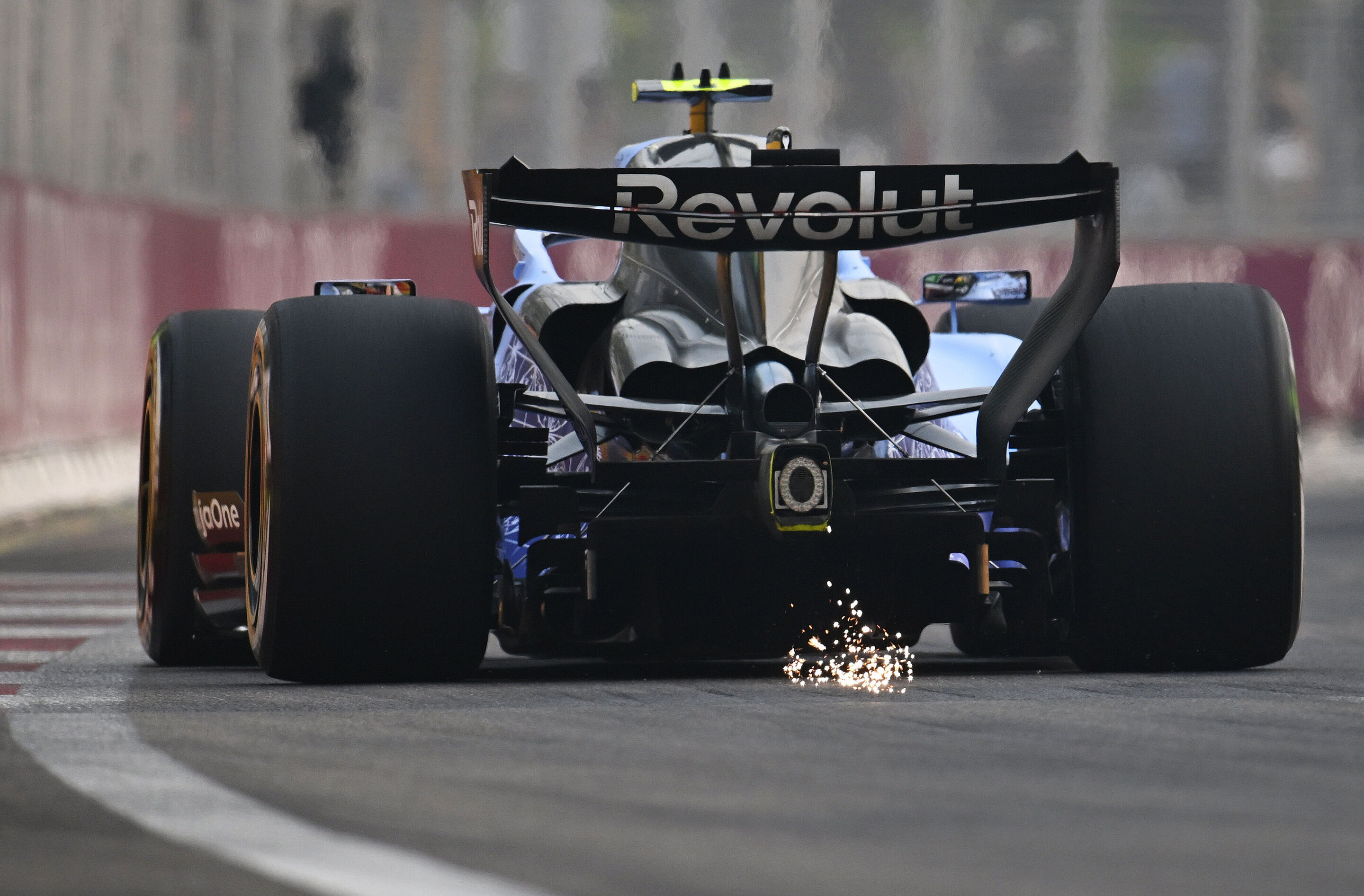 F1 Grand Prix Of Singapore - Practice & Sprint Qualifying - SINGAPORE, SINGAPORE - OCTOBER 09: Sparks fly behind Gabriel Bortoleto of Brazil driving the (5) Audi F1 Team R26 on track during practice ahead of the F1 Grand Prix of Singapore at Marina Bay...