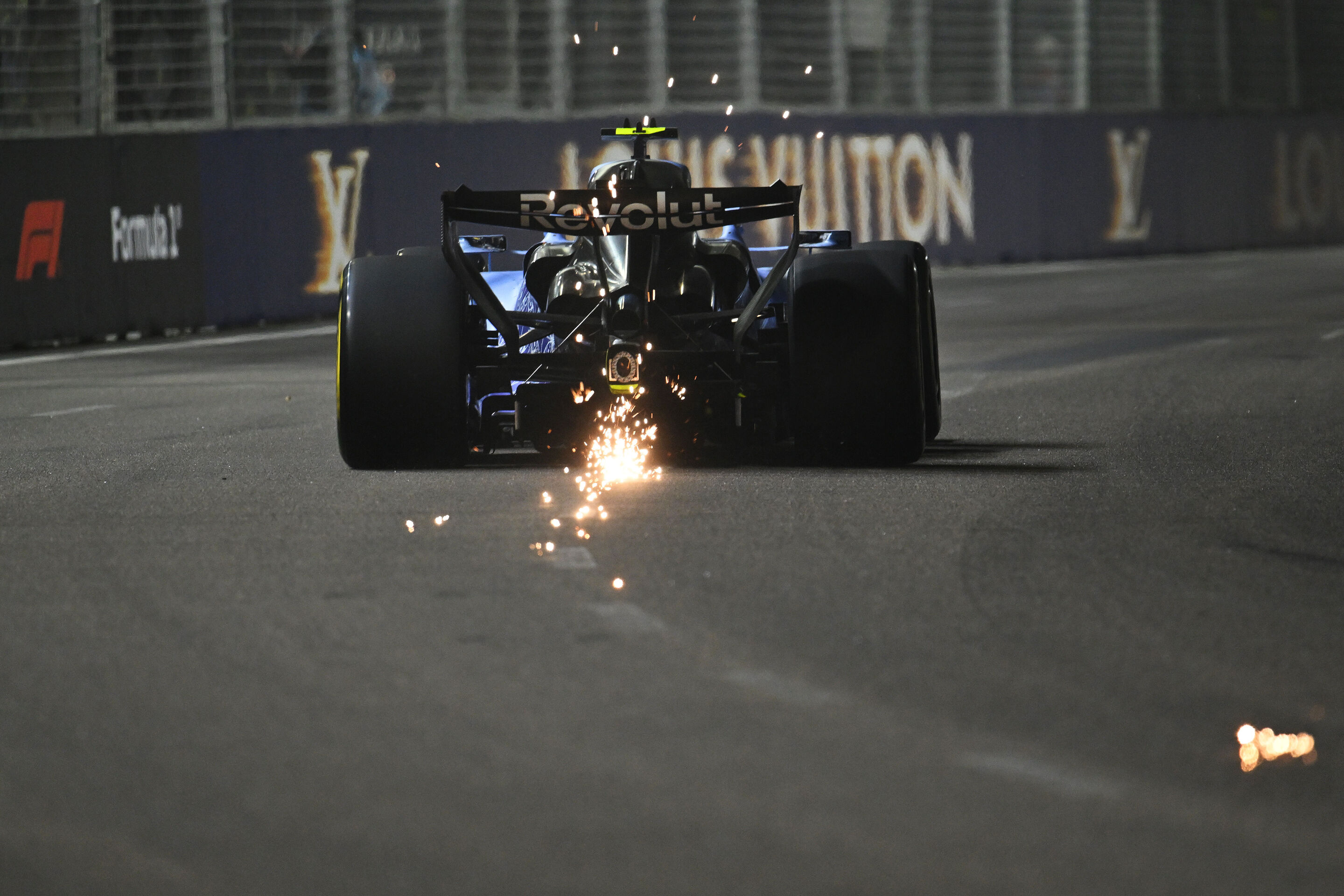 F1 Grand Prix Of Singapore - Practice & Sprint Qualifying - SINGAPORE, SINGAPORE - OCTOBER 09: Sparks fly behind Gabriel Bortoleto of Brazil driving the (5) Audi F1 Team R26 on track during Sprint Qualifying ahead of the F1 Grand Prix of Singapore at...
